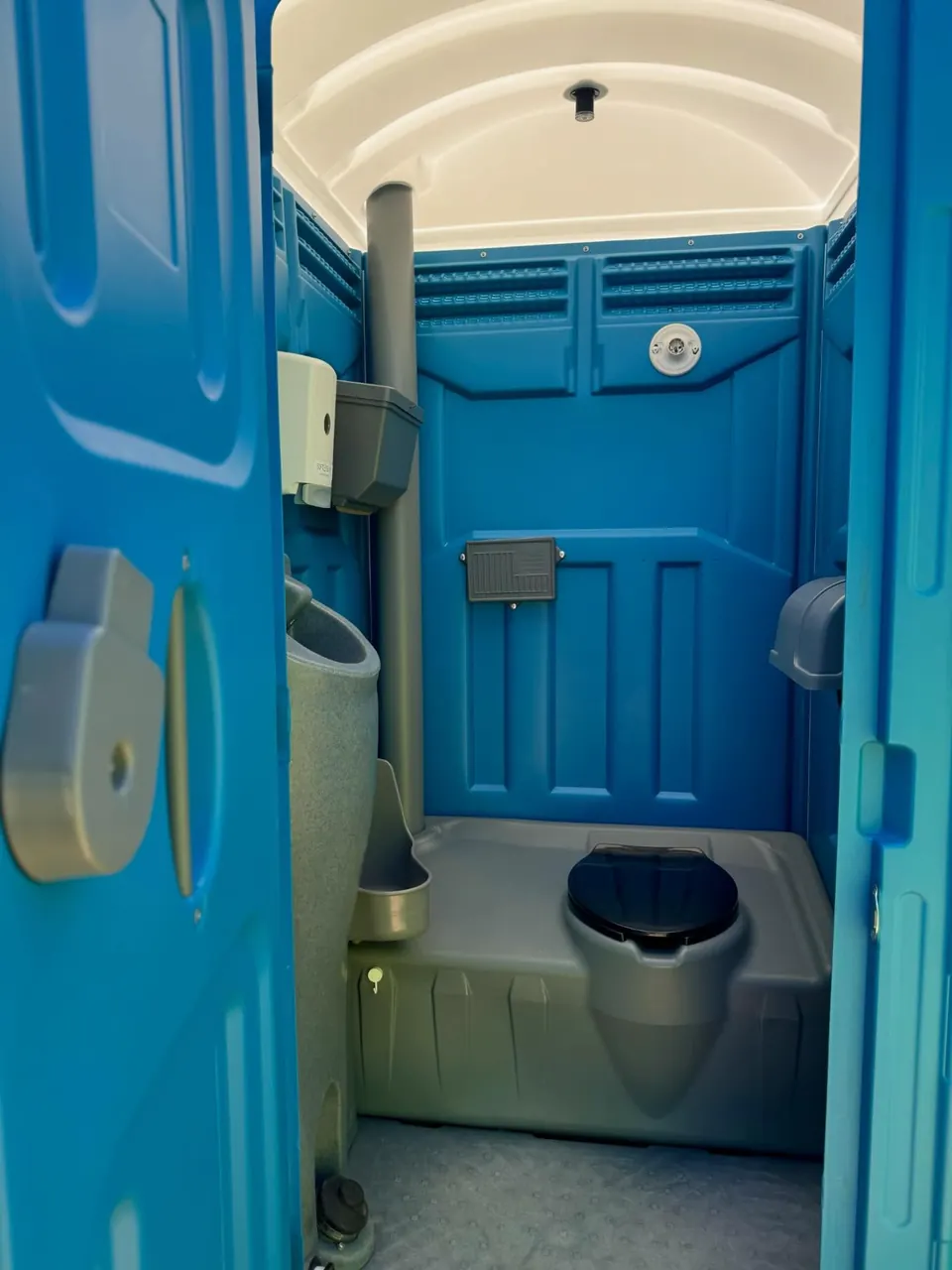 Interior layout of a blue portable toilet